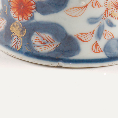 Imari porcelain chocolate bowl and associated saucer (Bowl, rim, close-up of nick (1)), China, Qing Dynasty, Kangxi, early 18th century